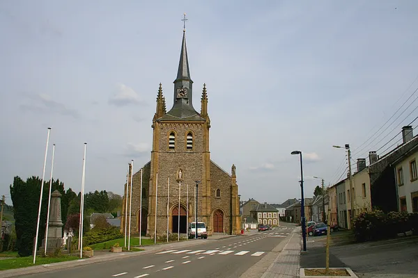 Sugny (Belgium): the memorial dedicated in honour to the victims of the two last world wars and the St. Martin's church (1851).