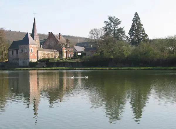 Godinne (Belgium), the St. Peter church (XVII/XVIIIth centuries) alongside the Meuse river.
