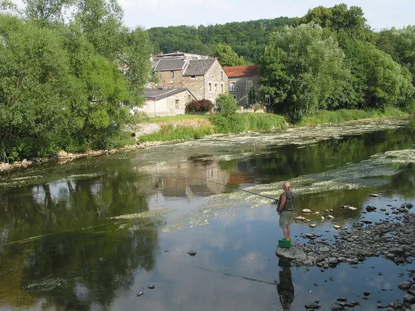 Comblain-la-Tour (Belgium), fisherman on the banks of the Ourthe river.
