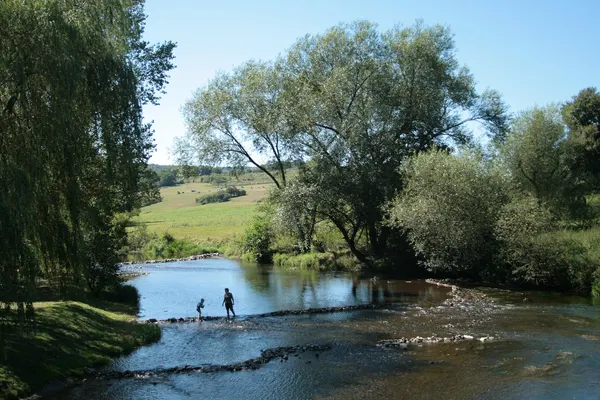 Treignes (Belgium), the Viroin river seen from the old bridge.