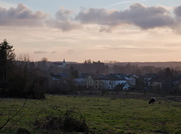 Entering Les Bulles on the GR-16 (Rue de la Chevrette) during golden hour