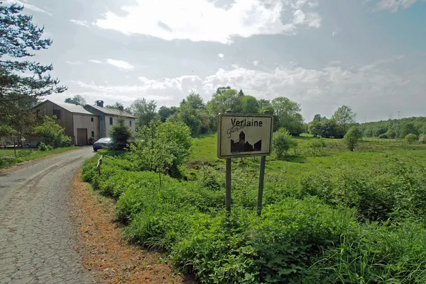 Neufchâteau (Verlaine), Belgium: The entrance of the village at the Voie de Cher crossing en afluent of the river Rau de Grandvoir