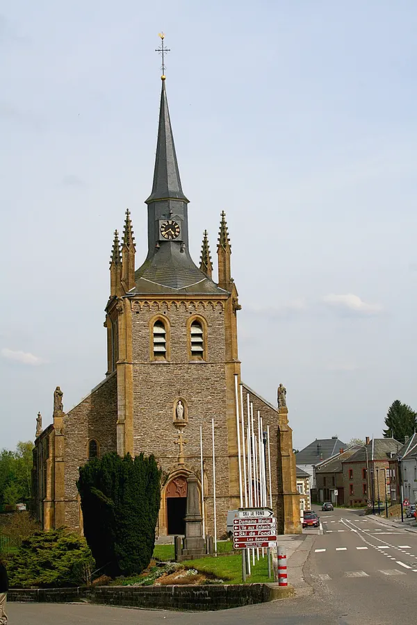 Sugny (Belgium): the memorial dedicated in honour to the victims of the two last world wars and the St. Martin's church (1851).