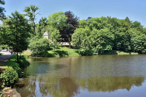 Pond at Pont-d'Oye in the Belgian commune of Habay. The castle is seen in the background at left.